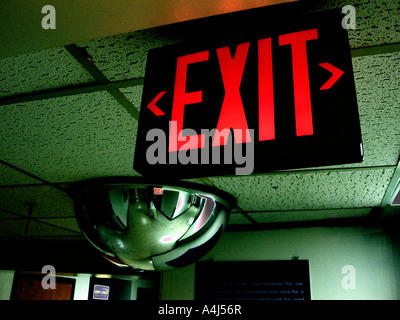 empty hospital corridor leading to emergency room showing EXIT Stock Photo
