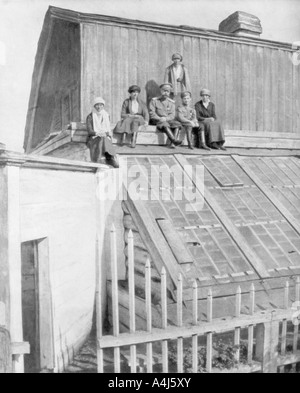 Tsar Nicholas II and his children sitting on a greenhouse, Tobolsk, Siberia, Russia, 1917. Artist: Unknown Stock Photo