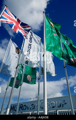 Flags bearing the MG Rover Group s branding outside the headquarters in Longbridge Birmingham UK Stock Photo