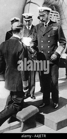 King George V knights Vice-Admiral Pakenham aboard HMS Princess Royal, c1930s. Artist: Unknown Stock Photo