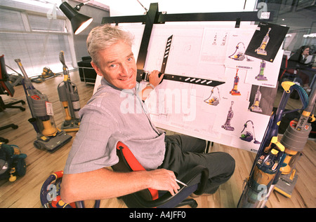 JAMES DYSON WITH HIS HERON PARIGI ITALIAN DRAWING BOARD IN HIS OFFICE AT THE DYSON FACTORY IN MALMESBURY GLOUCESTERSHIRE UK Stock Photo