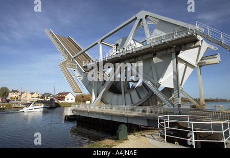 Small boat passes underneath Pegasus Bridge raised, Benouville, Normandy, France - site of a famous D-Day battle Stock Photo