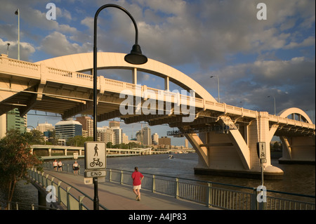 Joggers and walkers on the River Walk along the Brisbane River. Stock Photo