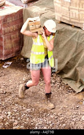 A FEMALE BRICKLAYER UK Stock Photo