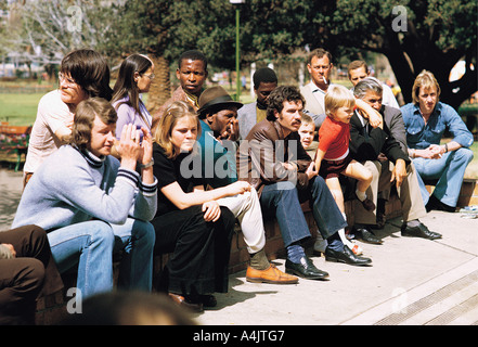 Mixed race group of people watching chess players in Joubert Park in Johannesburg South Africa Stock Photo