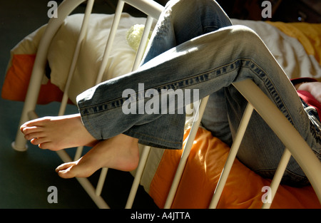 Relaxation in her bed. Stock Photo