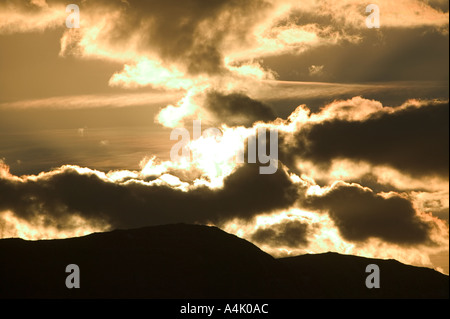 Clouds at sunset over Coniston Fells Lake District Stock Photo