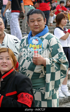 Sumo wrestlers in summer yukata kimono attend a pop concert in central Tokyo Japan Asia Stock Photo