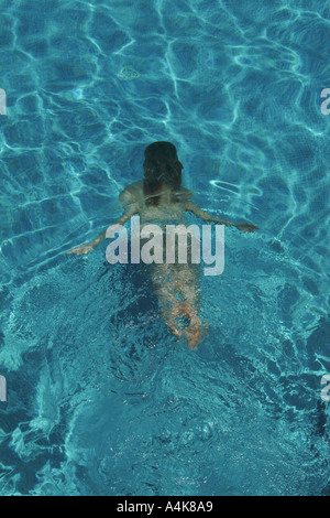Woman in bikini swimming underwater in a pool Stock Photo - Alamy
