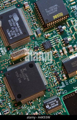 Silicone chips and electrical components on a printed circuit board Stock Photo