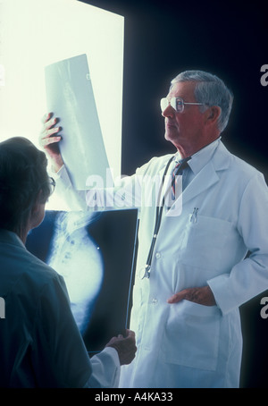 man and woman doctors examine x-rays at hospital Stock Photo