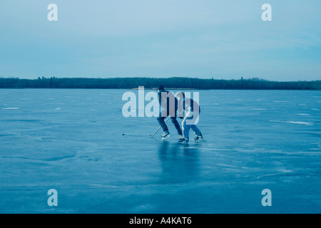 Playing hockey together Stock Photo