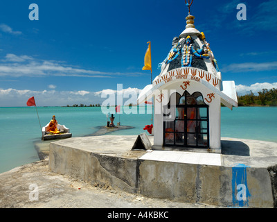 Anse La Raie Mauritius Shri Baba Shrine with Shiva and Parvati Statues in the Sea with Kali Statue on Sign and Om Symbol Stock Photo