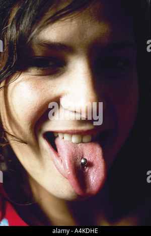 Young woman showing tongue piercing Stock Photo