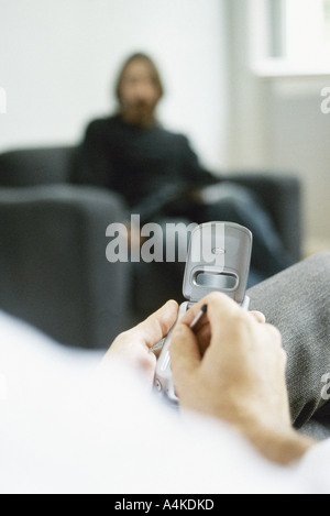 Man using electronic organizer Stock Photo