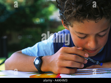 Boy doing homework Stock Photo