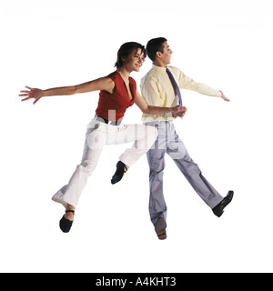 Man and woman jumping in different poses Stock Photo