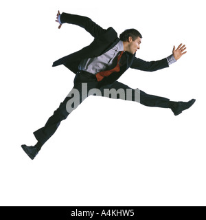 one business man jumping running silhouette Full length in studio Stock