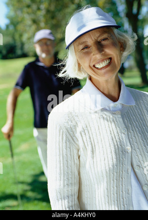 Mature couple playing golf Stock Photo