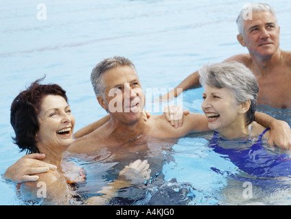 Mature couples in pool Stock Photo