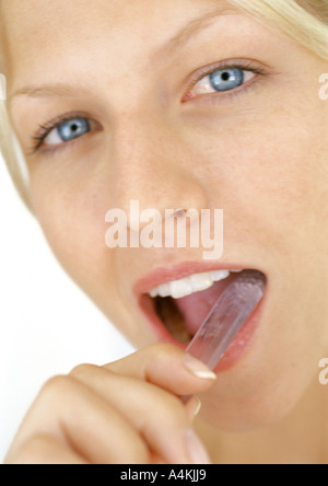 Young woman brushing teeth Stock Photo