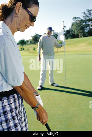 Mature couple playing golf Stock Photo