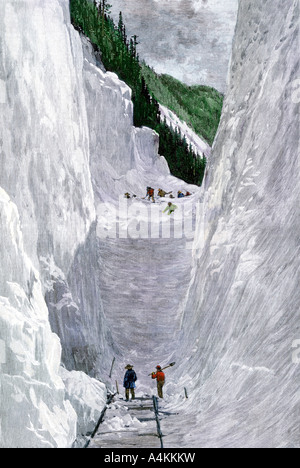 Digging out railroad tracks buried under snow in the Colorado Rockies 1880s. Hand-colored woodcut Stock Photo