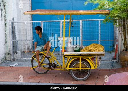 A peanut vendor on the streets of Malacca Stock Photo