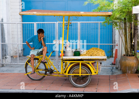 A peanut vendor on the streets of Malacca Stock Photo