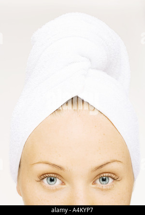 Woman with towel wrapped around head Stock Photo