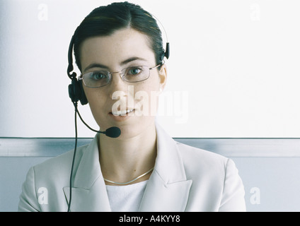 Professional woman wearing headset, portrait Stock Photo