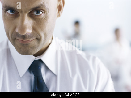 Businessman looking at camera with eyebrow raised Stock Photo