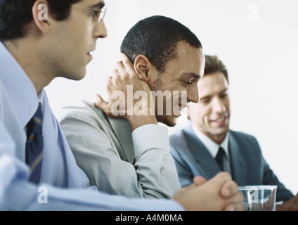 Businessmen sitting together in meeting Stock Photo