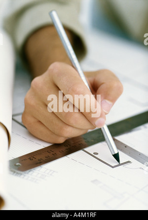 Hand drawing on blueprints Stock Photo