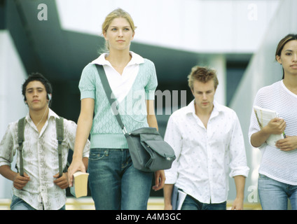 Students walking, front view Stock Photo