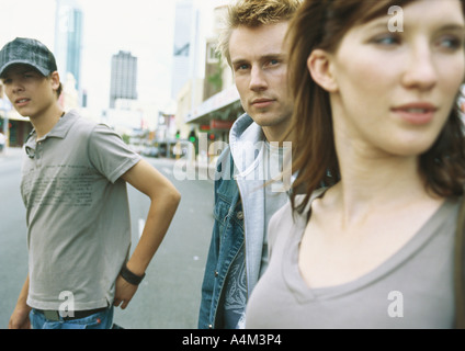 Young people standing in street Stock Photo