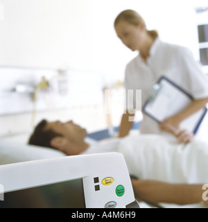 Nurse checking on patient Stock Photo