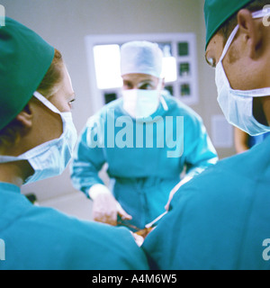 Doctors performing operation Stock Photo