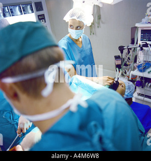 Doctors performing operation Stock Photo