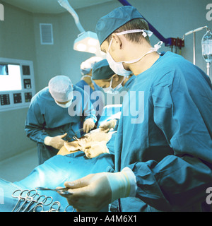 Doctors performing operation Stock Photo