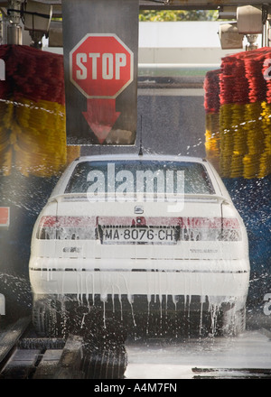 Spanish saloon motor car in car wash tunnel Stock Photo