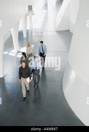Group of businesspeople walking through lobby, high angle view Stock Photo