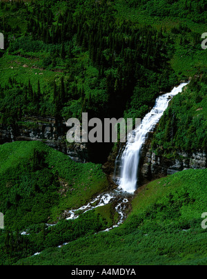 Spring waterfall on Reynolds Creek Logan Pass Glacier National Park Stock Photo