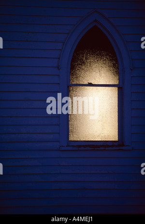 Close-up of an arched Church window with closed internal shutters, USA ...