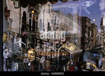 ITALY VENICE Arts and antiques shop window in the Campo San Barnaba district. Reflections of Venice canal in shop window Stock Photo