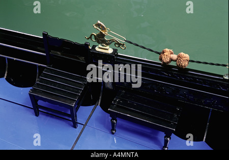 ITALY VENICE Overhead view of gondola showing wooden seating and traditional sea horse ornament Stock Photo