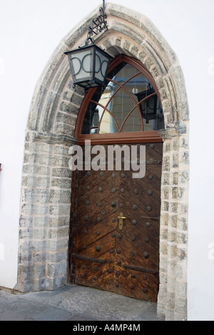 Old wooden door in stone arch Tallinn Estonia Stock Photo