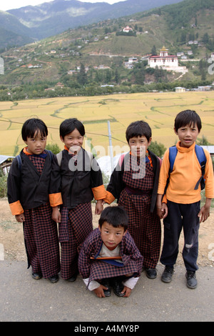 Young students with traditional clothes, Paro, Bhutan Stock Photo
