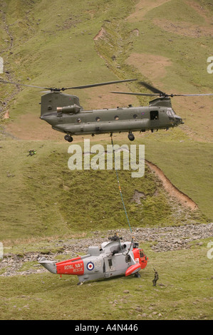 Chinook airlifting crashed Sea King helciopter in Langdale valley Lake district Stock Photo