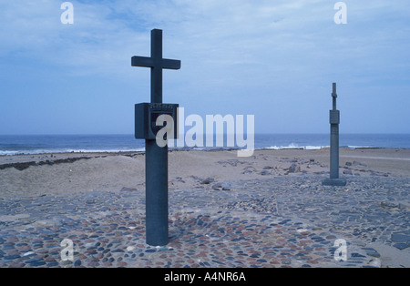 Cross placed by portugiese seafarer Diaz at Cape Cross Namib desert and atlantic ocean Namibia Africa Stock Photo